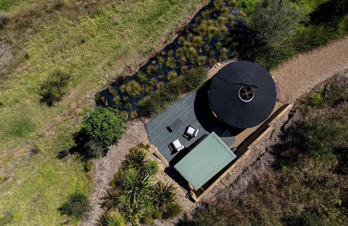 Palm Beach Cabin | Awaawa Yurts - Papa Yurt - Awaawa Yurts offer a luxury glamping experience on Waiheke Island. Stunning views, luxury queen sized bed, private bathroom with tea and coffee making facilities.