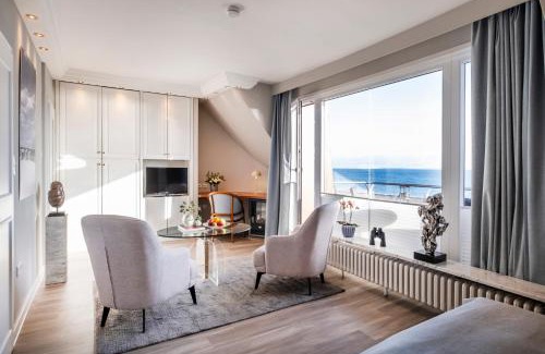Strande Hotel | Büngers Apartment-Hotel mit Sommerstrandkorb & Gartensauna