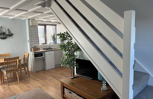 Bude House | Barn conversion overlooking the golf course to the sea