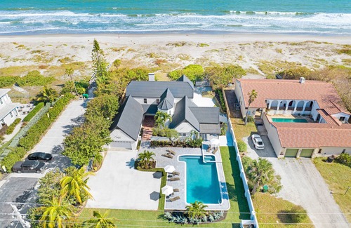 Cocoa Beach House | Beach Front Home with Gated entry Large sparkling pool and private beach access