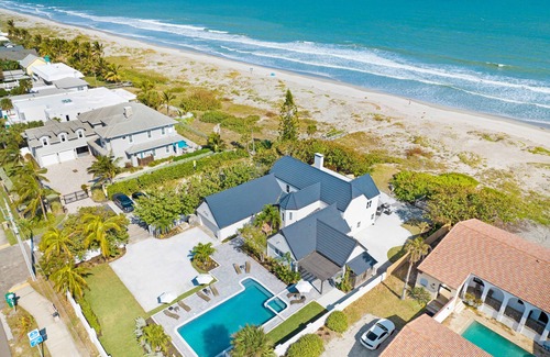 Cocoa Beach House | Beach Front Home with Gated entry Large sparkling pool and private beach access
