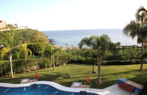 Velilla-Taramay Apartment | Beachfront apartment, swimming pool with salt water, gardens 2 min walk to the beach.