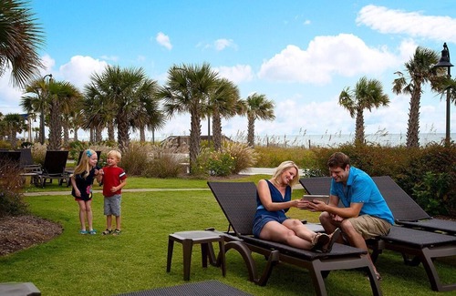 Downtown Myrtle Beach Apartment | Beachfront Beauty: King Room with Scenic Balcony