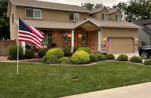 River Bottoms House | Beachy Home in Provo. Large deck with builtin hot tub, Fire pit, Palapa