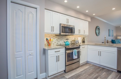 Naples Heritage Condo | Beautiful 1st. floor unit totally renovated with lake view!