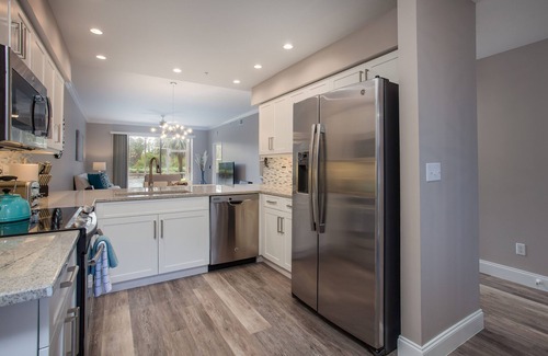 Naples Heritage Condo | Beautiful 1st. floor unit totally renovated with lake view!