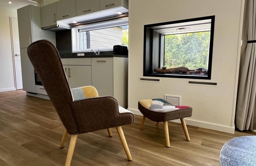 Sint Maartensvlotbrug House | Beautiful, brand new and uniquely designed chalet with pretty garden. Very spacious, modernly furnished for 5 people with luxurious "infinity" gas fireplace, wash-and-dryer and free WiFi.