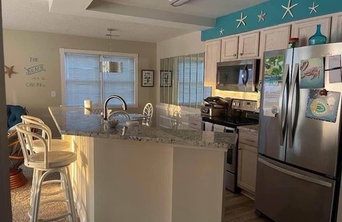 Calabash Condo | Beautiful condo overlooking the 8th hole on Magnolia course,lagoon with turtles.