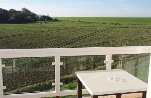 Wremen Apartment | Beautiful North Sea apartment with sauna, sunny balcony and wonderful country views