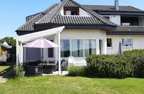 Ellenberg Apartment | Beautiful large vacation apartment "Seeschwalbe" with a fantastic view of the Schlei and a well-kept garden with many cozy spots is waiting for you to let your soul dangle