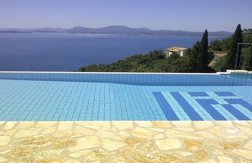 Barbati Villa | Beautifully Restored Olive Press, Private Pool, Jacuzzi, Stunning Sea Views 5 mins to Nissaki Resort