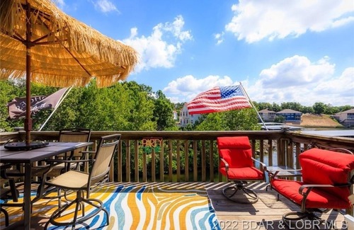 Lake Ozark Condo | BEAUTIFULLY UPDATED LAKEFRONT CONDO & OVERSIZED DECK, WI-FI, 2 Pools, hot tub.