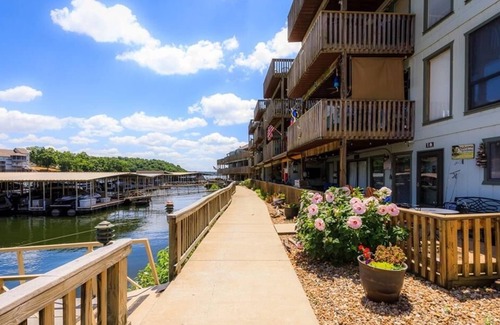 Lake Ozark Condo | BEAUTIFULLY UPDATED LAKEFRONT CONDO & OVERSIZED DECK, WI-FI, 2 Pools, hot tub.