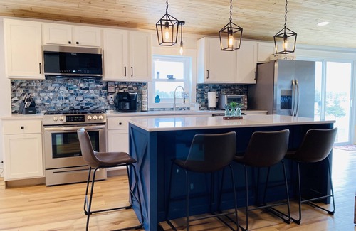Rapid City House | Best View on Torch lake! Private frontage, boat dock and across from the sandbar