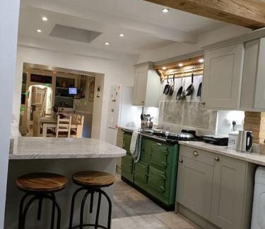 Llanelli House | Big fireplace aga hot tub wet room barn garage