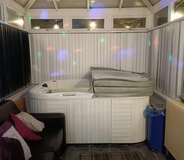 Llanelli House | Big fireplace aga hot tub wet room barn garage