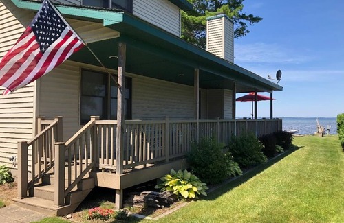 Onaway House | Black Lake sunset waterfront home 78' private sandy beach on prestine Black Lake