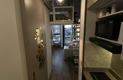 Barrios Unidos Apartment | Blessing House: Modern retreat with balcony, close to everything in Bogota.