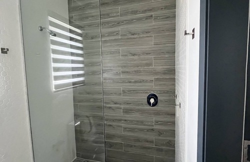 Nassau Condo | Blu at Villa Nova. Stylish Modern Condo, Minutes away from the Beach.