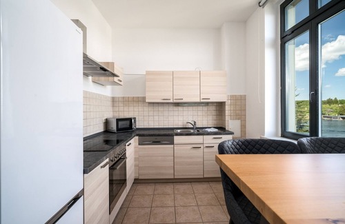 Muritz Apartment | Blue Sea vacation apartment in the heart of Malchow with lake view and fireplace