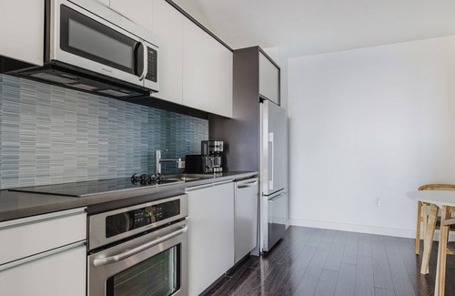 Boston Apartment | Blueground | East Boston, art & pool, nr park