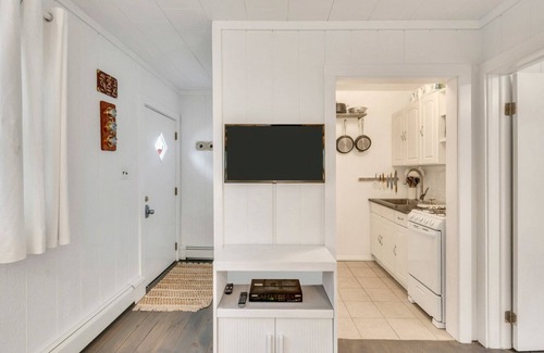 Montauk Apartment | Bohemian-style hotel unit with ample natural light, a cozy seating area,.