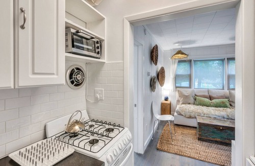 Montauk Apartment | Bohemian-style hotel unit with ample natural light, a cozy seating area,.