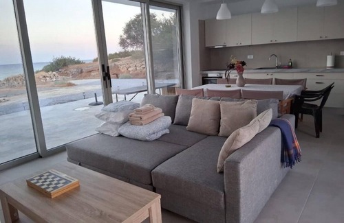 Makry Gialos House | Brand new beachfront house in Koutsouras — 30 steps to crystal-clear water!