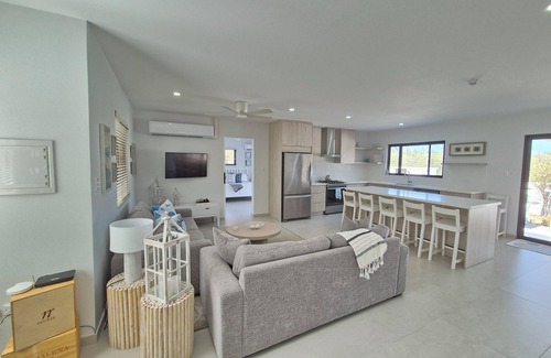 Kamay Villa | Brand New Modern 3-bedroom Villa with waterfall pool and minutes to Palm Beach!n