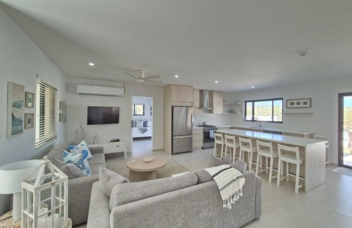 Kamay Villa | Brand New Modern 3-bedroom Villa with waterfall pool and minutes to Palm Beach!n