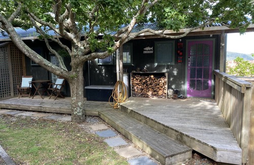 Ahipara House | "Breakview" - quiet, comfortable bach with a spa pool, for families and surfers.