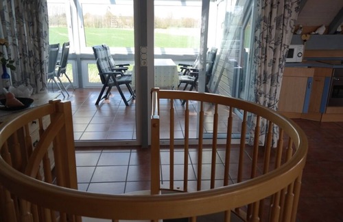 Dornum Apartment | Bright apartment (70 sqm) with all-round view right at the bottom - fishing, free WiFi