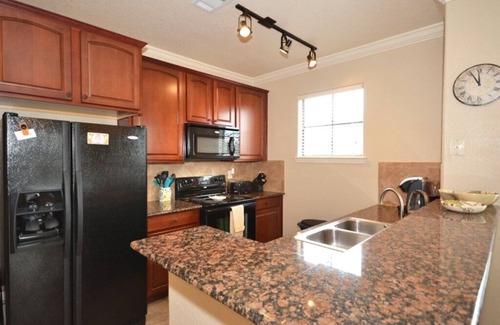 Regal Palms Condo | Bright condo with south facing balcony overlooking pond
