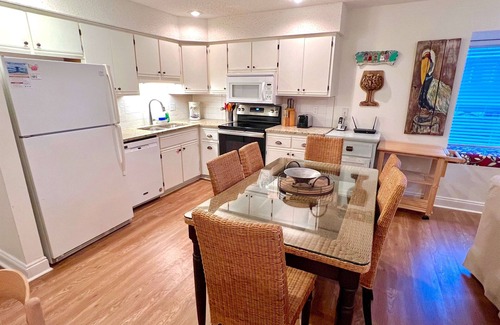 Port St. Joe House | Bright end unit across from pool -steps to beach ramp -beach chairs & cart incl.