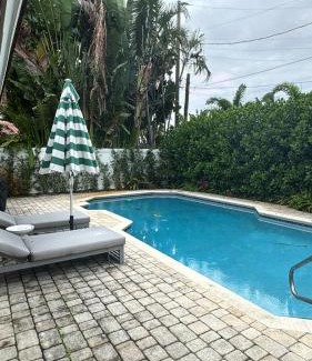 South Corals Villa | Bright Fort Lauderdale Villa with Private Heated Pool, Modern Décor and Palm-Lined Outdoor Oasis