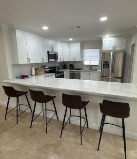 South Corals Villa | Bright Fort Lauderdale Villa with Private Heated Pool, Modern Décor and Palm-Lined Outdoor Oasis