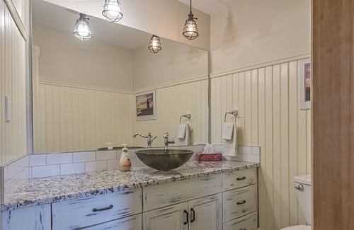 Vernon Apartment | Bright Ground Level Studio Suite is situated in the Historical Carew House