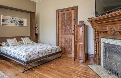 Vernon Apartment | Bright Ground Level Studio Suite is situated in the Historical Carew House