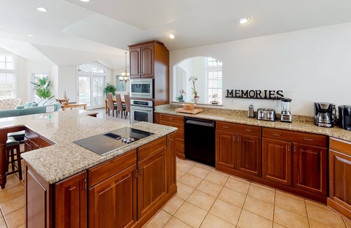 Sandbridge House | Bright & open waterfront home with private pool, sunset views, decks & elevator