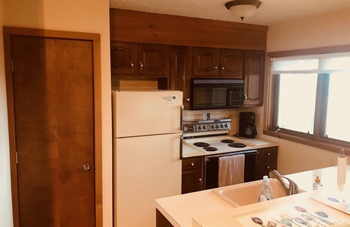 Bellaire Condo | Cali King 2 room with fireplace sleeps 5(4 adults) with sunset lake views!