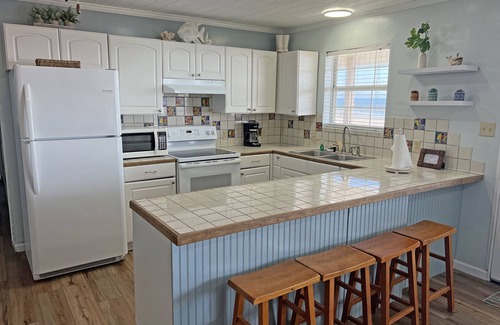 Grand Isle House | Camp Castaway - Beachfront - Island Realty