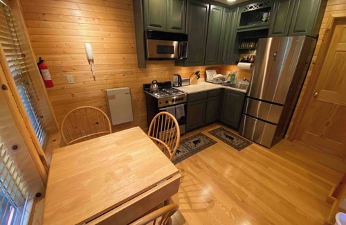 Pinecrest Cabin | Camp Leland · Dog Friendly 4-Season Cabin + Garage, meadow view