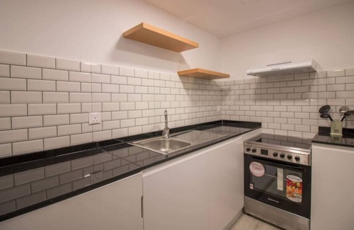 Jumeirah Lake Towers Apartment | Canal-Side Charm: Studio living at Dubai Arch