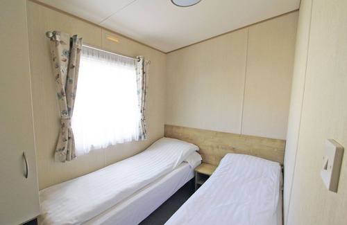 Alford House | Caravan with one double and one twin.