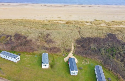 Irstead House | Caravan with one double, twin bedroom and a bunk room.