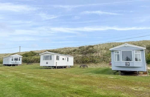Irstead House | Caravan with one double, twin bedroom and a bunk room.