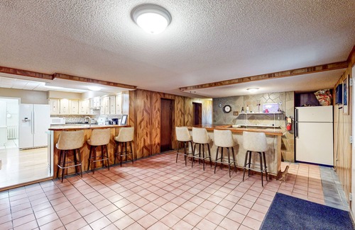 Madawaska House | Centrally located home near snowmobile trails with hot tub, sauna, & pool table