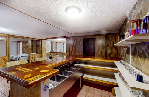 Madawaska House | Centrally located home near snowmobile trails with hot tub, sauna, & pool table