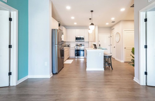 Loughman Apartment | Charming 2-bedroom family oasis near Disney with W/D, WiFi, Pool and more!