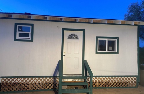 Prescott Cottage | Charming Casita with a fireplace, and a private patio and golf course views.